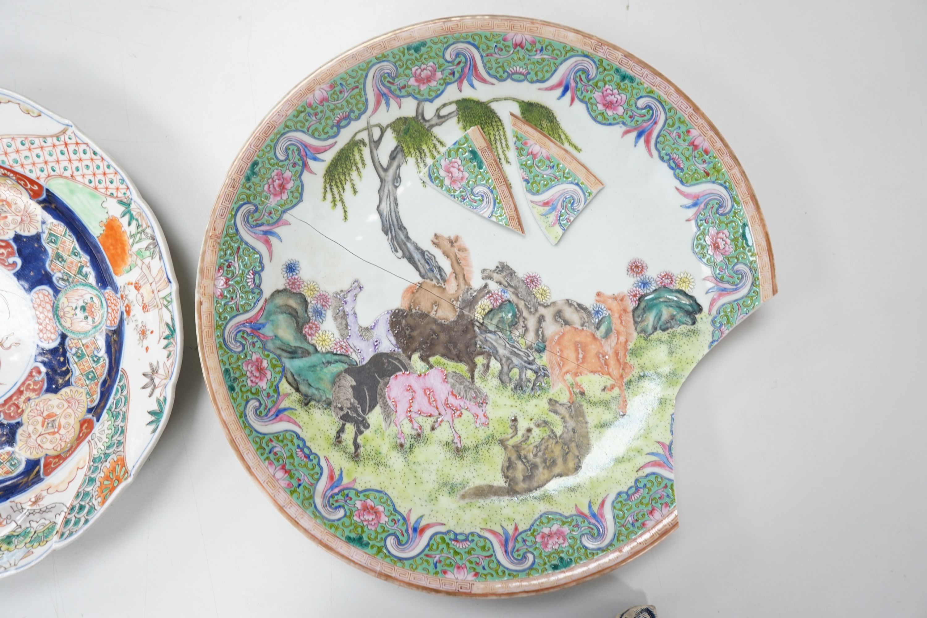 A 19th century Japanese Imari dish, 30cm and a damaged Chinese famille rose dish, 33.5cm 34cm